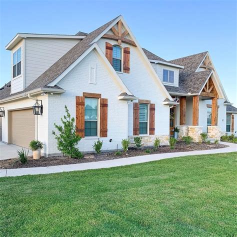 white house with cedar shutters.